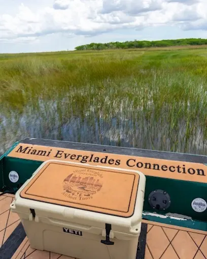 A Miami Everglades Connection cooler on the airboat deck facing the sawgrass