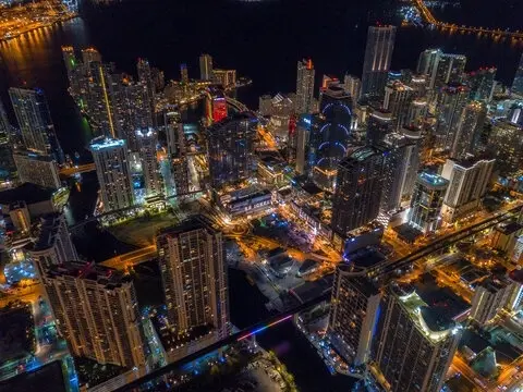 Downtown Miami towers lit up at night seen from above