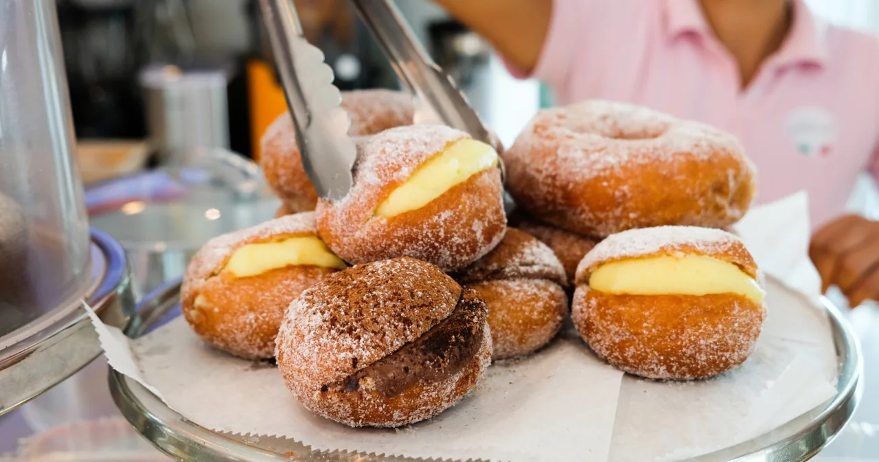 An assortment of filled donuts displayed on a plate