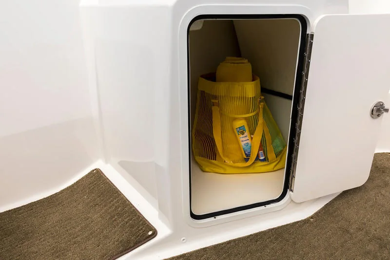 Yellow safety equipment inside a boat storage compartment