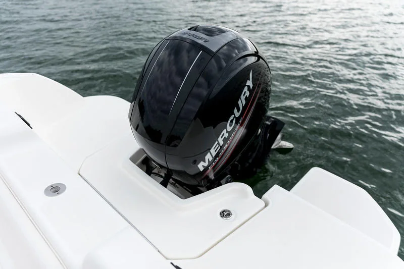 An outboard motor above the water at the boat’s stern