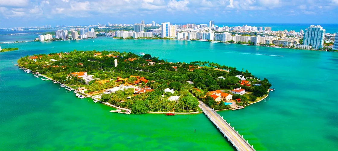 An island surrounded by turquoise bay water