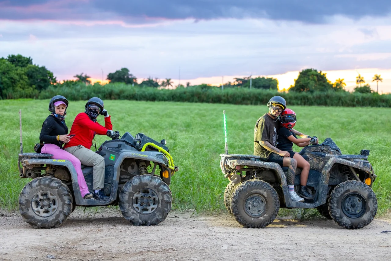 ATV riders on a grassy trail in the Miami tour listing