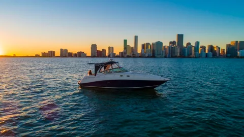 Boat on Biscayne Bay at sunset with the Miami skyline