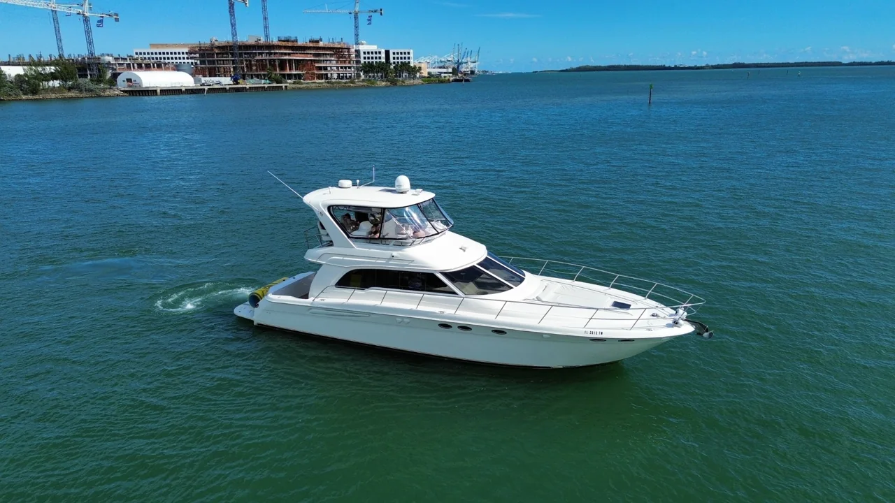 White motor yacht on Miami bay water